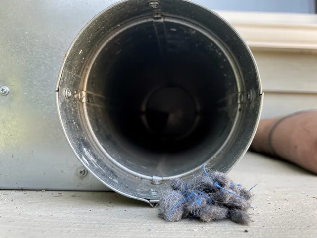 Miramar Dryer Vent Cleaning technician using specialized equipment to clear severe dryer vent blockage in Miramar